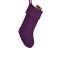 Detail of purple knitted Christmas stocking with cable texture and green gift box decoration - Purple
