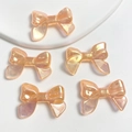 Five luminous orange UV pearlescent bow beads for DIY jewelry and phone charms - 1 Bead / Glowing Glitter Light Orange
