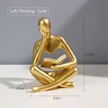 Nordic abstract thinker resin sculpture in matte gold finish with dimensions 8.5x6.5x11.5cm - Gold Left Reading