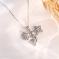 Macro shot of silver ocean charms with starfish and blue crystal dolphins on a necklace - Silver Starfish & Shell