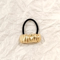 Black elastic hair tie with textured gold hollow metal charm in wavy ripple finish - Gold Irregular Wave 5cm