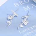 Minimalist silver rose flower earrings with sleek bar pendant on a blue background - Silver