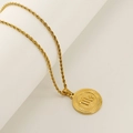 Gold plated stainless steel necklace featuring a round Virgo zodiac pendant on a twist chain - Scorpio