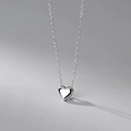 Close-up of heart-shaped zircon pendant with high-polished silver finish and fine chain - Silver Heart