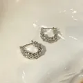Elegant s925 silver hoop earrings with dense sparkling texture on white ceramic - Dense Texture Hoop (A1766 Silver)