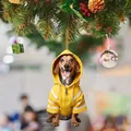 Christmas dachshund ornament wearing a yellow hoodie hanging on a festive Xmas tree - 14-Yellow Hoodie Dachshund