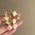 Detailed close-up of golden brushed flower petal earrings with baroque pearl drops - 925 Silver Needle Style (31#)
