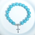 Blue turquoise bead bracelet with a silver cross charm on a clean white background - Blue Turquoise Silver Cross