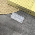 Transparent silicone 3D flower nail mold shown with ruler for precise size measurement - #166 Plum Blossom