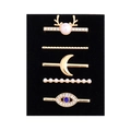 Detailed set of 5 golden decorative charms for silicone watch bands with pearls and blue gems - Deer Head Eye and Moon Design (D3012) / Black Sponge Packaging