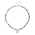 Detail of colorful beaded necklace with golden bubble letter O pendant and heart charm - Letter D