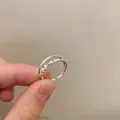 Detail of silver double-layered open ring featuring beaded texture and minimalist band - Silver - Double Layer Bead Stacking