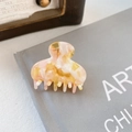Pink and creamy marble acetate hair claw clip for elegant styling on a book - 4cm / Pink Yellow