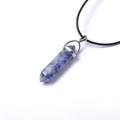 Macro detail of hexagonal sodalite crystal pendant with silver cap on black cord - Blue Spot Stone