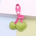 Pink PU leather cherry keychain featuring green heart fruits and gold snap button - Rose Stem Green Fruit