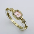 Detail of flower-shaped golden bracelet watch with crystal bezel and pink dial - Gold Case Pink Dial