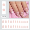 Close-up of almond-shaped press-on nails with white French tips and silver glitter accents - W870 Pure Desire Heart