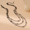 Triple layer stainless steel necklace with elegant black beads on apricot background - Three-layer Bead Chain Style / Black