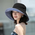 Close-up of black wide brim sun hat with stylish blue and white striped lining detail - M (56-58cm) / Black+Stripes