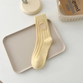 Creamy yellow ribbed cotton crew sock with a pink embroidered smiley face detail - One Size / Milky Yellow