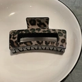Detail shot of rectangular leopard print hair claw clip in a white ceramic bowl - Coffee Leopard