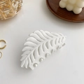 Matte white leaf-shaped claw clip for thick hair displayed on a wooden tray - Hollow Leaf / White (Leaf Style)