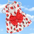Detail of red strawberry print on white pet dress with large red bow and pearl hanger - XS / Red Strawberry Dress