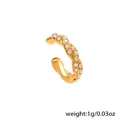 Macro detail of 18k gold plated stainless steel ear cuff set with white zircon stones - Twist Zirconia Ear Cuff (F428) / Gold