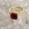 Detailed close-up of a golden stainless steel ring featuring a red square-cut zircon stone - US6 (Circumference 52mm) / Gold Base: Jan-Red