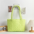 Macro shot of green quilted fabric tote bag showing detailed 3D flower stitching patterns - Yellow-Green