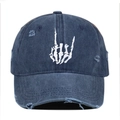 Close-up of navy blue washed denim cap with skull hand embroidery and distressed detail - Navy Blue