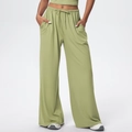 Detail of high waist drawstring and side pockets on green wide-leg lounge pants - Lime Green