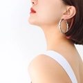 French style silver twisted hoop earrings in polished steel worn by a fashion model - Large / Steel