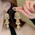 Detail shot of vintage gold tassel earrings with pearls on a model's ear - 31# Silver Pin - Gold