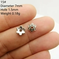 Macro detail of 7mm vintage silver daisy flower bead spacers with size measurements - Style 15