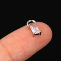 Rectangle cut clear zircon charm in silver setting held on fingertip for scale - CC166 Rectangle / White Gold