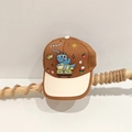 Detail of cartoon dinosaur print and 'good baby' embroidery on kids baseball cap - Brown / 52cm (2-5 Years)