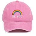 Detail of the colorful rainbow and BE YOU embroidery on a pink washed cotton baseball cap - One Size / Pink