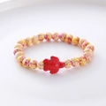 Detailed close-up of beaded bracelet with spotted yellow beads and a red turtle charm - Yellow Purple Pink Spotted Red Turtle Bracelet