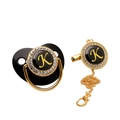 Detail of black pacifier set with gold letter K and sparkling rhinestone accents - Letter K