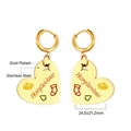 Detailed close-up of gold plated stainless steel heart earrings with Christmas engraving - Christmas Heart Drop Earrings