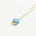 Sky blue heart pendant necklace with gold liquid drip design on minimalist white background - Blue