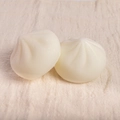Set of two white steamed bun slow-rebound toys with realistic pleat texture detail - PU Material / 6cm Pointed Bun