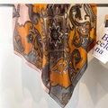 Detail of warm orange paisley satin scarf draped on a metal rod with silk gloss - Orange Brown Paisley Style (FM180-2)