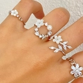 Silver flower ring set with mother of pearl and pearls on model hand - Shell Flower Ring Jewelry Set (X829)