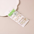 Detail of 5-piece hair clip set featuring resin hearts, fabric flowers, and pearls - Green System (Style A)
