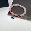 Pink crystal evil eye beaded bracelet with gold accents and sparkling round charms - Natural Stone Light Pink