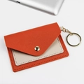 Slim PU leather card holder with keychain in orange and beige color block design - Orange