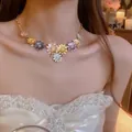 Choker necklace featuring colorful daisy pendants with gold chain and tiny crystals - Colorful Flower