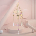 Detail of sun and moon metal charms with iridescent crystal prisms on a gold frame - Style B